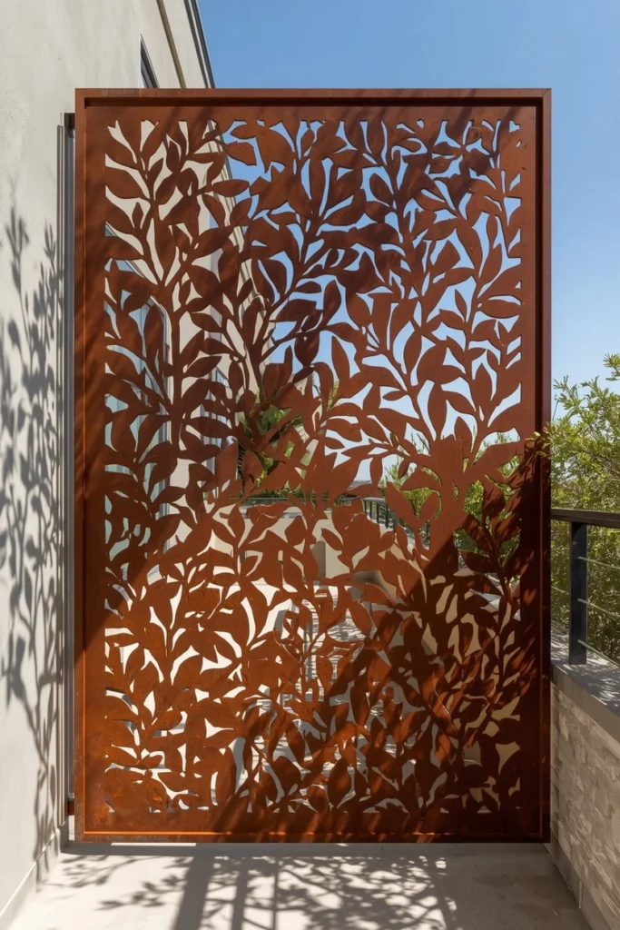 Corten steel privacy screen with decorative patterns
